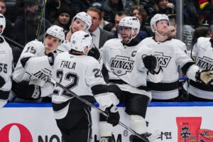 Kevin Fiala of the Los Angeles Kings is congratulated at the players bench after scoring a goal against the Vancouver Canucks.