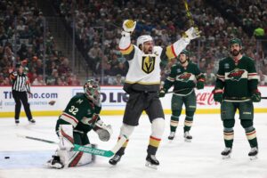 Shea Theodore #27 of the Vegas Golden Knights celebrates after scoring a goal against Filip Gustavsson #32 of the Minnesota Wild