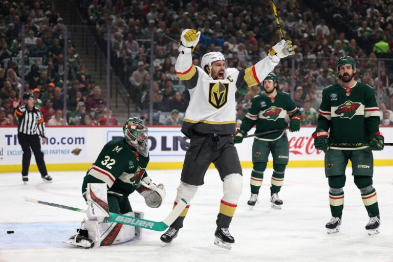 Shea Theodore #27 of the Vegas Golden Knights celebrates after scoring a goal against Filip Gustavsson #32 of the Minnesota Wild