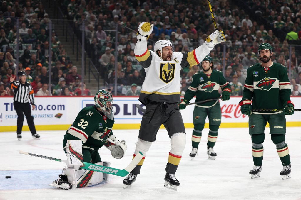Shea Theodore #27 of the Vegas Golden Knights celebrates after scoring a goal against Filip Gustavsson #32 of the Minnesota Wild