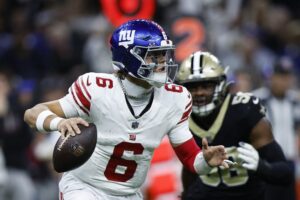 Jaxson Dart #6 of the New York Giants looks to pass in the game against the New Orleans Saints.