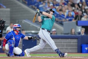 Cal Raleigh #29 of the Seattle Mariners hits a single against the Toronto Blue Jays