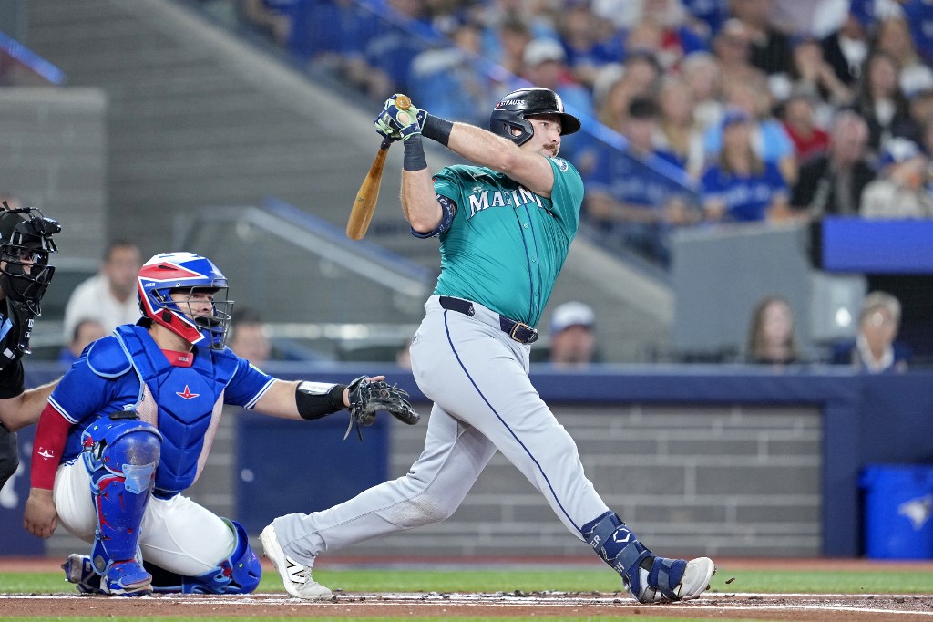 Cal Raleigh #29 of the Seattle Mariners hits a single against the Toronto Blue Jays
