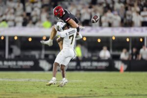 Antione Jackson #7 of the UCF Knights defends the ball away from Brock Rechsteiner #3 of the Jacksonville State Gamecocks
