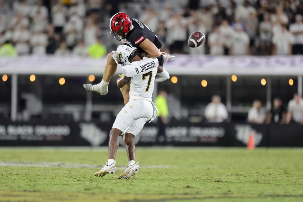 Antione Jackson #7 of the UCF Knights defends the ball away from Brock Rechsteiner #3 of the Jacksonville State Gamecocks