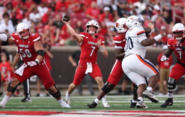 Miller Moss #7 of the Louisville Cardinals throws the ball against the Virginia Cavaliers