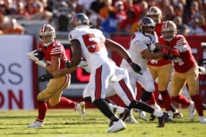 Christian McCaffrey #23 of the San Francisco 49ers in action against the Tampa Bay Buccaneers