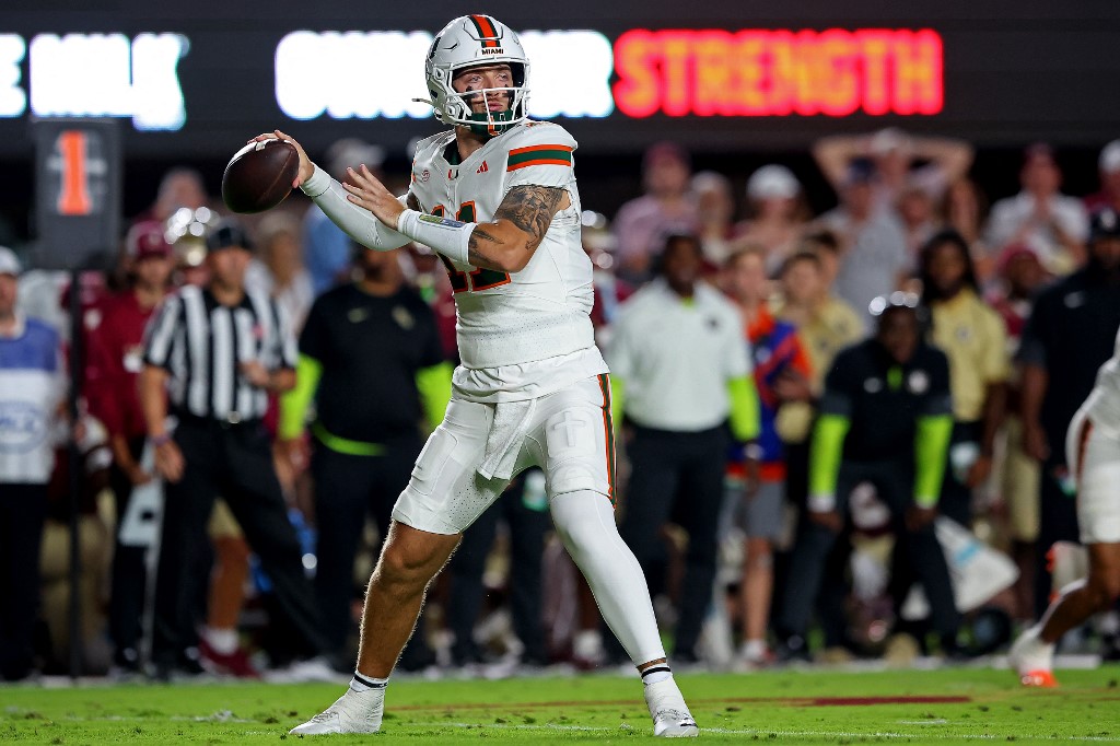Carson Beck #11 of the Miami Hurricanes prepares to throw a pass in the first half of the game against the Florida State Seminoles