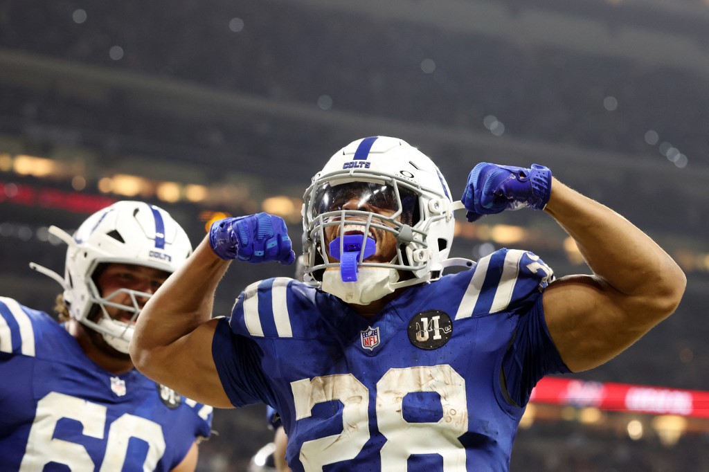 Indianapolis Colts' Jonathan Taylor, a top contender for NFL Offensive Rookie of The Year, celebrates after scoring a rushing touchdown against the Tennessee Titans.