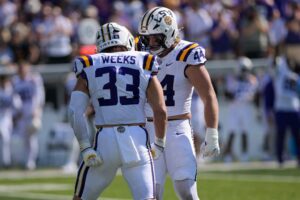 West Weeks and Jack Pyburn of the LSU Tigers celebrate a sack against the Vanderbilt Commodores.