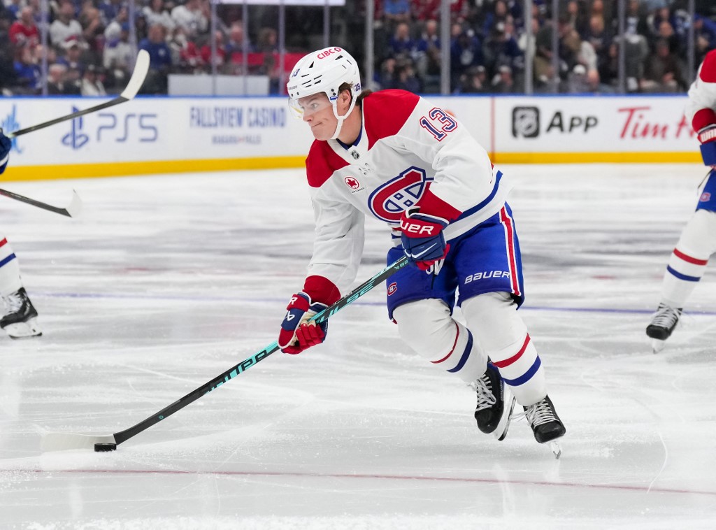 Cole Caufield #13 of the Montreal Canadiens skates against the Toronto Maple Leafs.