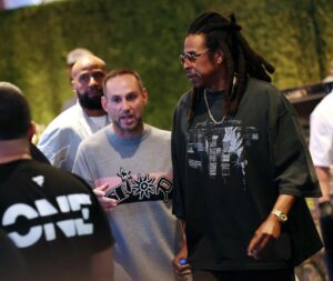 Founder and CEO of Fanatics, Michael Rubin (2L) and JAY-Z at the Fanatics Sportsbook