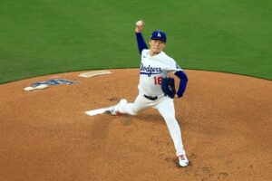 Yoshinobu Yamamoto #18 of the Los Angeles Dodgers pitches against the Philadelphia Phillies