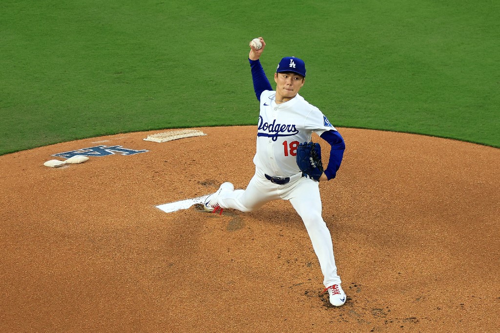 Yoshinobu Yamamoto #18 of the Los Angeles Dodgers pitches against the Philadelphia Phillies