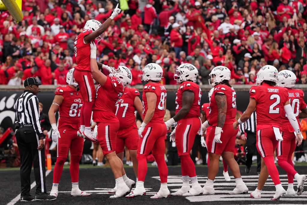 Evan Pryor #6 of the Cincinnati Bearcats celebrates with teammates after scoring a touchdown against the Baylor Bears