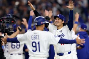 Shohei Ohtani #17 of the Los Angeles Dodgers celebrates on the field after defeating the Toronto Blue Jays.
