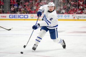 Simon Benoit #2 of the Toronto Maple Leafs shoots the puck against the Detroit Red Wings