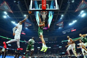 Guard Donovan Mitchell #45 of the Cleveland Cavaliers shoots over center Jericho Sims #00 of the Milwaukee Bucks