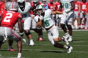 Running back Jordan Houston #6 of the Marshall Thundering Herd carries the ball during the first quarter against the Ohio State Buckeyes