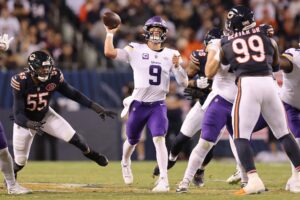 J.J. McCarthy #9 of the Minnesota Vikings throws a pass against the Chicago Bears
