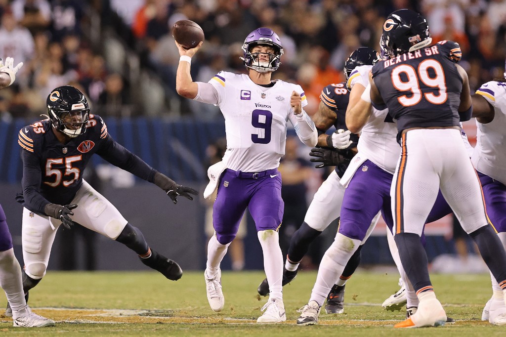 J.J. McCarthy #9 of the Minnesota Vikings throws a pass against the Chicago Bears