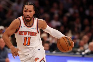Jalen Brunson #11 of the New York Knicks drives against the Boston Celtics