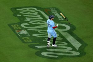 Alejandro Kirk #30 of the Toronto Blue Jays tosses his bat after grounding out during the ninth inning against the Los Angeles Dodgers.