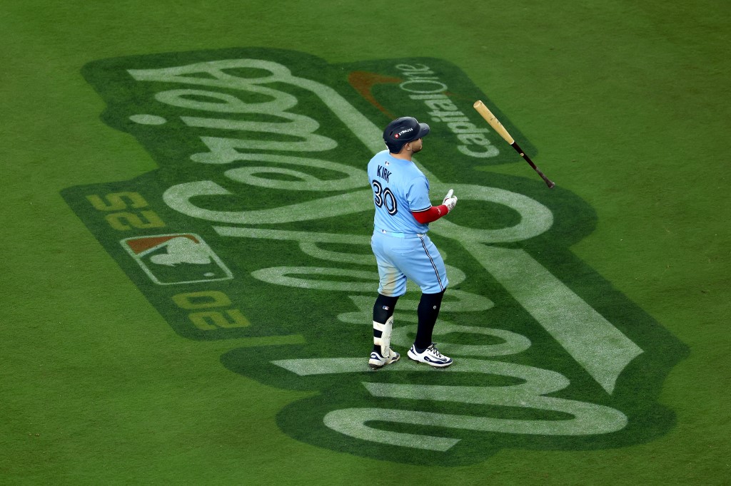 Alejandro Kirk #30 of the Toronto Blue Jays tosses his bat after grounding out during the ninth inning against the Los Angeles Dodgers.