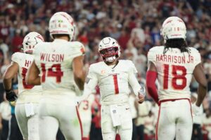 Kyler Murray #1 of the Arizona Cardinals congratulates Marvin Harrison Jr. #18 after a touchdown against the Seattle Seahawks.