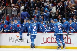 Nathan MacKinnon #29 of the Colorado Avalanche celebrates a goal with his teammates against the Montreal Canadiens.