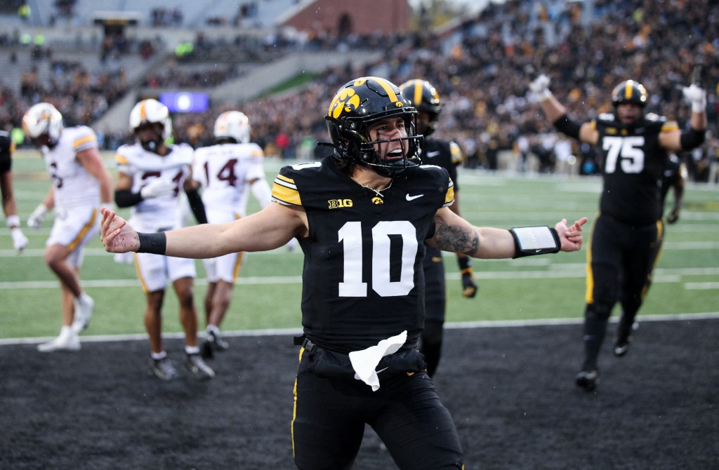 Quarterback Jeremy Hecklinski #10 of the Iowa Hawkeyes celebrates after running in a touchdown in the second half against the Minnesota Golden Gophers.