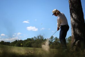 The cover for World Wide Technology Championship picks article shows Garrick Higgo of South Africa playing a shot out of the rough on the third hole