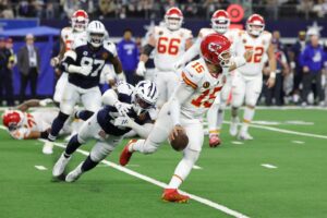 The cover for this Sunday night football picks article shows Patrick Mahomes #15 of the Kansas City Chiefs looks to pass during a game against the Dallas Cowboys.