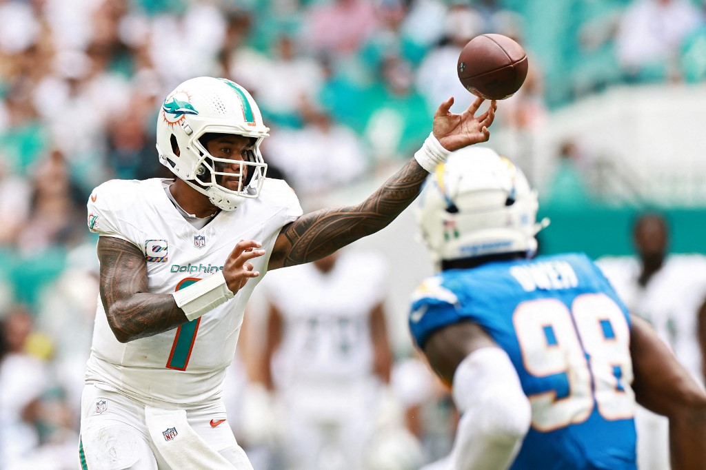 The cover for this Sunday football picks shows Tua Tagovailoa #1 of the Miami Dolphins in action during the NFL 2025 game between the Los Angeles Chargers and Miami Dolphins