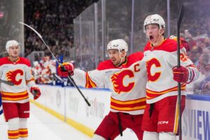 Samuel Honzek #29 of the Calgary Flames ,one of our top NHL picks today, celebrates his first career NHL goal against the Toronto Maple Leafs.