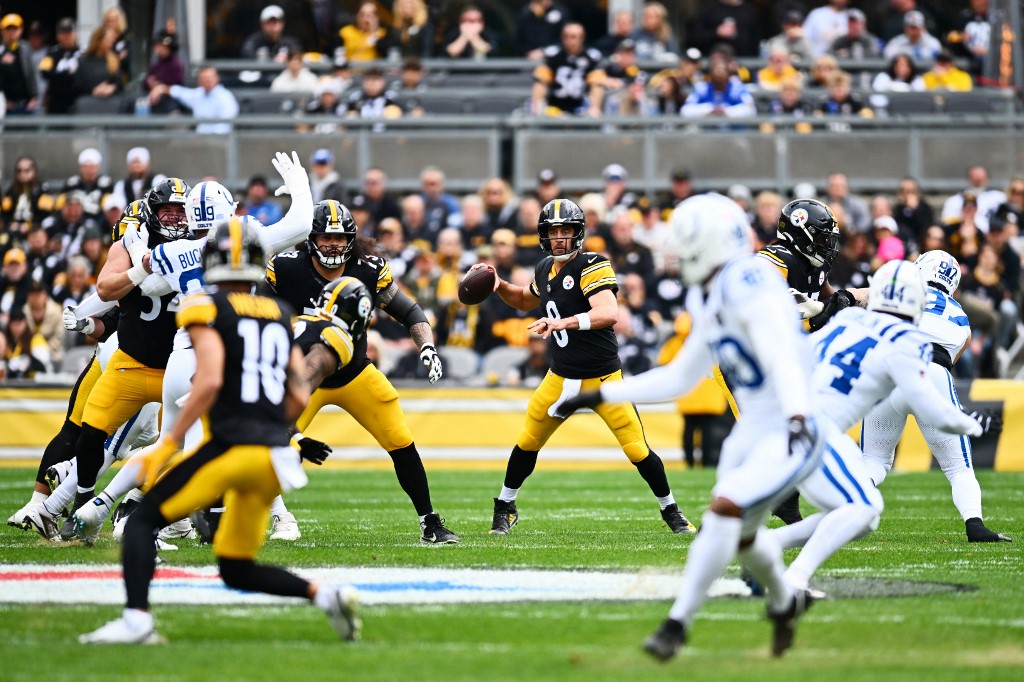 The cover for this Sunday night football picks article shows Aaron Rodgers #8 of the Pittsburgh Steelers looking to pass against the Indianapolis Colts