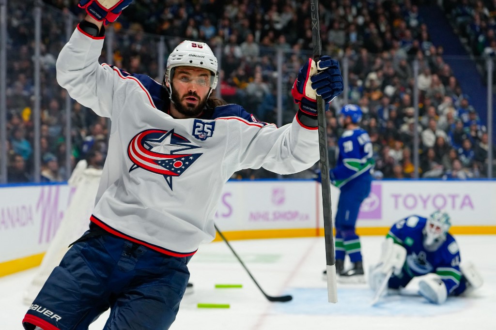 Kirill Marchenko of the Columbus Blue Jackets, one of our top picks for NHL anytime goal scorer props, celebrates after scoring a goal against the Vancouver Canucks.