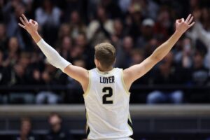 Fletcher Loyer of the Purdue Boilermakers, featured in our college basketball picks today, gestures after a three-pointer during the first half against the UIndy Greyhounds.