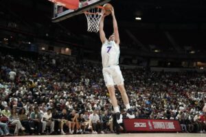 Kon Knueppel #7 of the Charlotte Hornets, featured in our NBA player props today, dunks against the the Utah Jazz.
