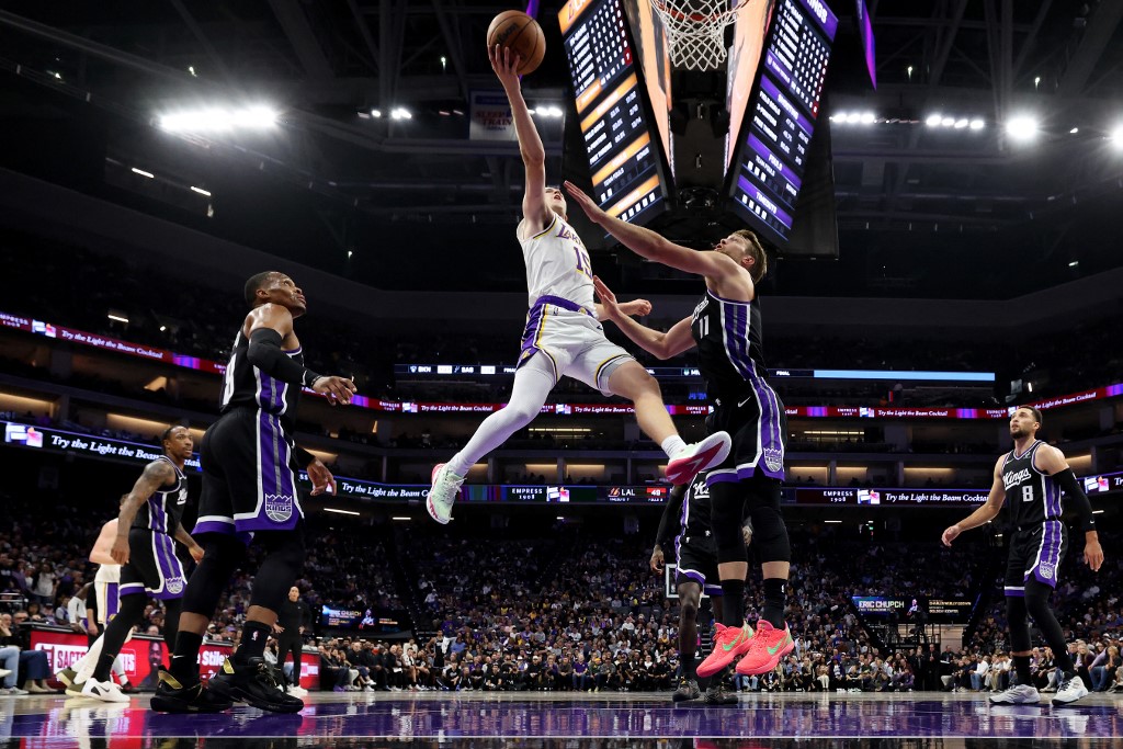 Los Angeles Lakers' Austin Reaves, featured in our NBA player props today, goes up for a shot against the Sacramento Kings.