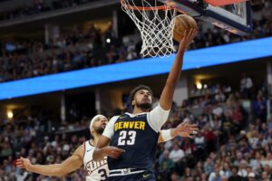 Denver Nuggets' Cameron Johnson, featured in our NBA player props today, goes to the basket against the Phoenix Suns.