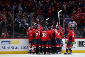 Alex Ovechkin of the Washington Capitals, a team featured in our NHL picks today, celebrates with teammates after scoring against the St. Louis Blues.