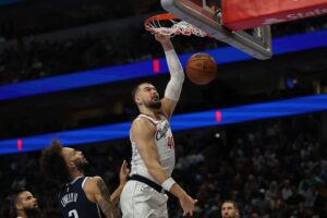 Ivica Zubac #40 of the LA Clippers dunks against the the Dallas Mavericks. Los Angeles is one of the teams featured in our NBA picks today.