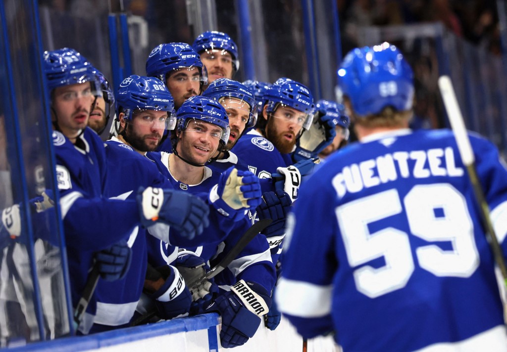 The Tampa Bay Lightning celebrate a second period goal by Jake Guentzel, one of the top picks for our NHL anytime goal scorer props.