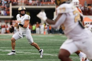 Diego Pavia #2 of the Vanderbilt Commodores, featured in our College Football odds week 14 preview, looks to pass during the game against the Texas Longhorns.