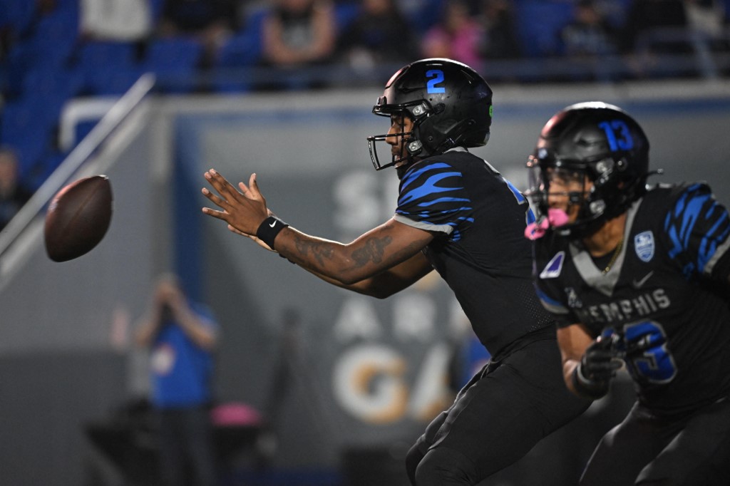 Brendon Lewis #2 of the Memphis Tigers, featured in our Thursday night college football picks, catches the ball against the Tulane Green Wave.