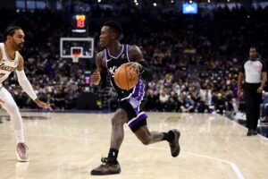 Dennis Schröder #17 of the Sacramento Kings dribbles the ball against the Los Angeles Lakers.