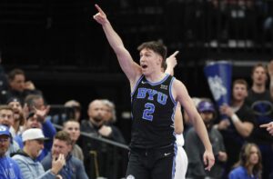 Tyler Mrus #2 of the Brigham Young Cougars points down court for ball possession during the game against the Wisconsin Badgers.