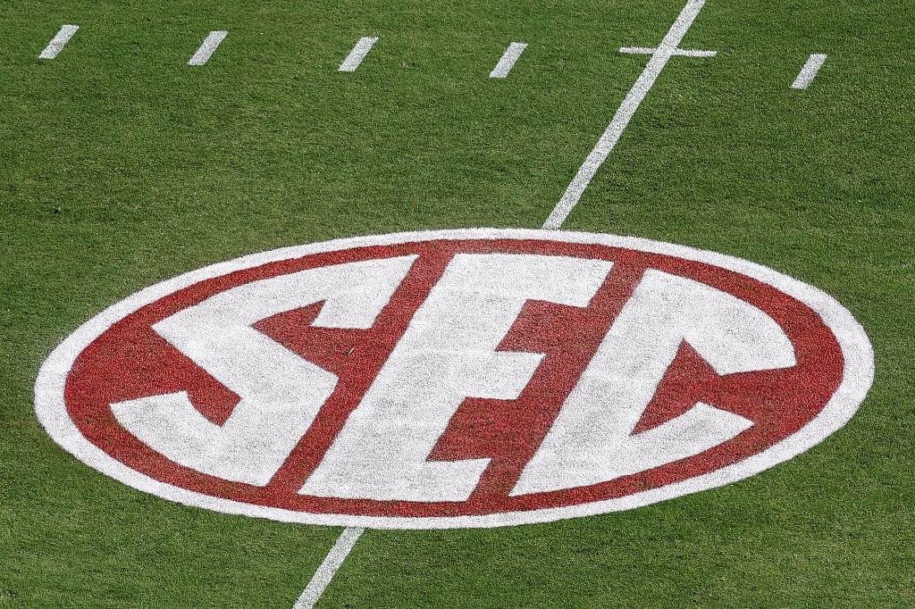 A crimson SEC logo is seen on the turf before the game between the Texas Longhorns and the Oklahoma Sooners at Cotton Bowl in Dallas, Texas.