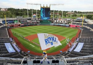 The Kansas City Royals mascot Sluggerrr waves a flag during player introductions prior at Kauffman Stadium in Kansas City, Missouri.
